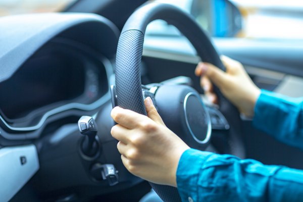 protect my car benefits review extended car warranty service man in blue shirt holding car wheel